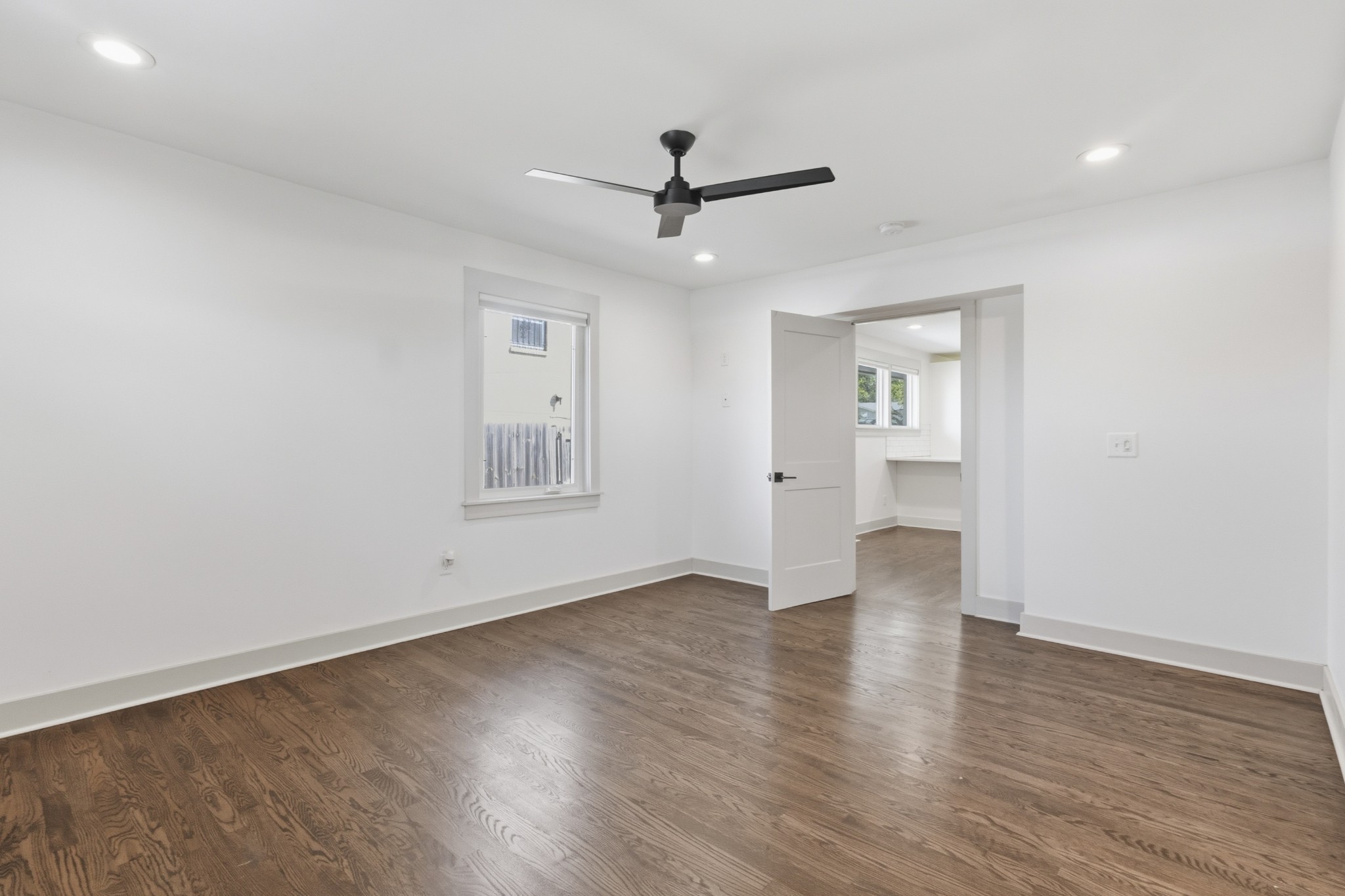 652 Moormans Arm Road Nashville, TN 37207 - Photo 11 of 25 a view of an empty room with a window and wooden floor