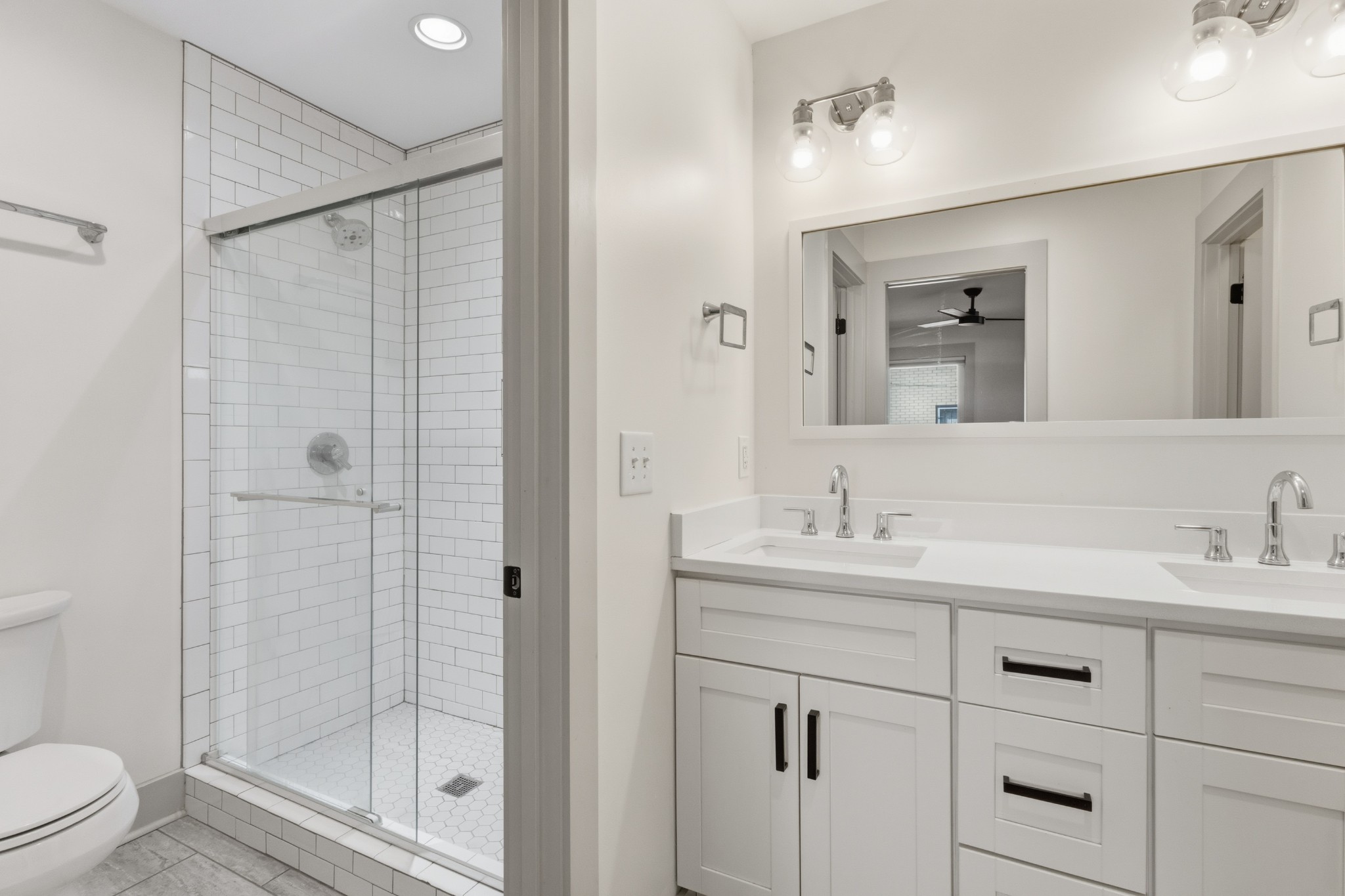 652 Moormans Arm Road Nashville, TN 37207 - Photo 12 of 25 a bathroom with a shower sink vanity mirror and toilet