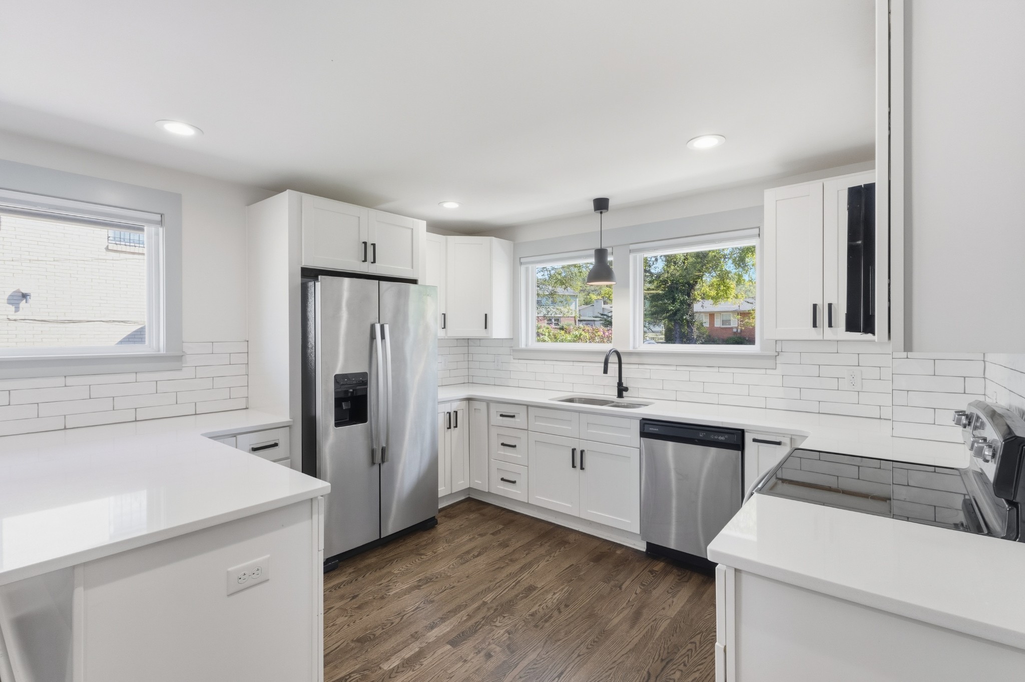 652 Moormans Arm Road Nashville, TN 37207 - Photo 4 of 25 a kitchen with white cabinets and white appliances
