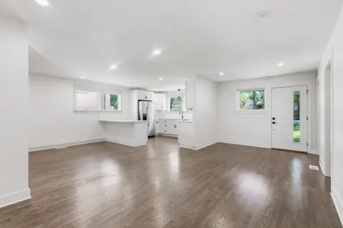 a kitchen with stainless steel appliances a refrigerator sink and microwave