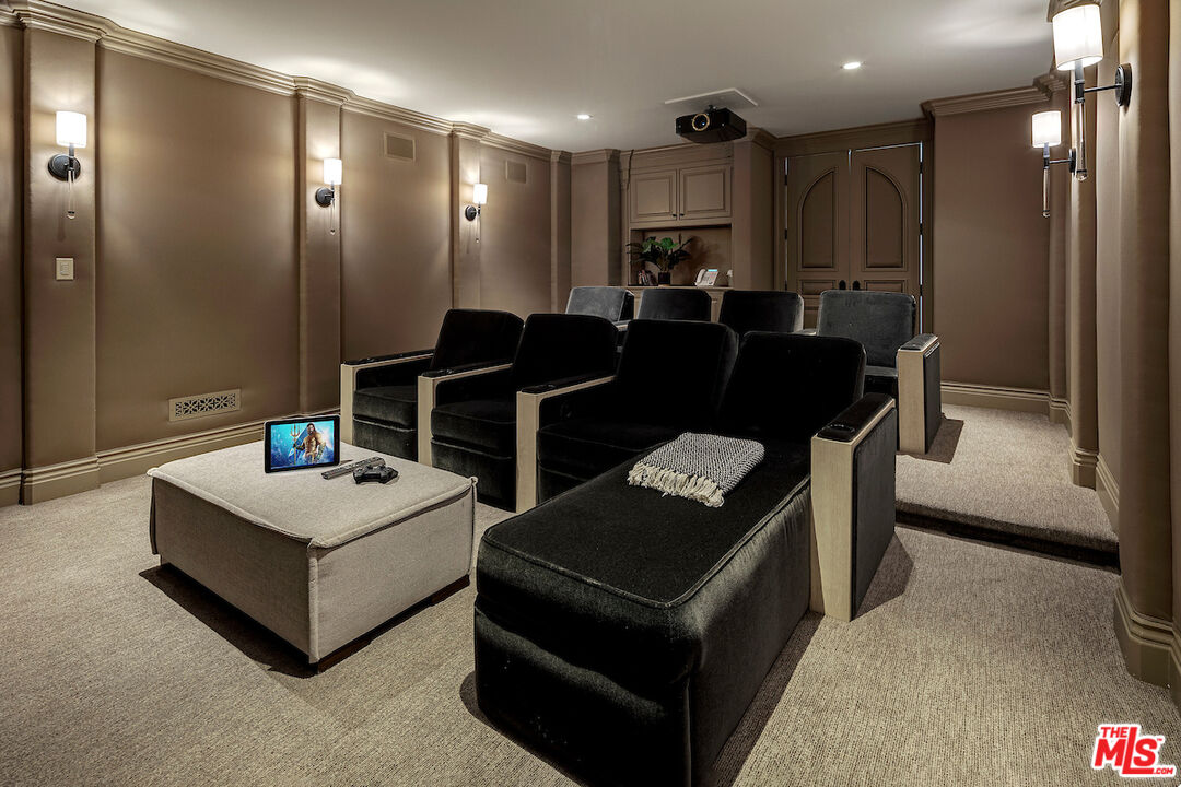 11025 Anzio Road Los Angeles, CA 90077 - Photo 19 of 34 a living room with stainless steel appliances kitchen island granite countertop furniture and a refrigerator
