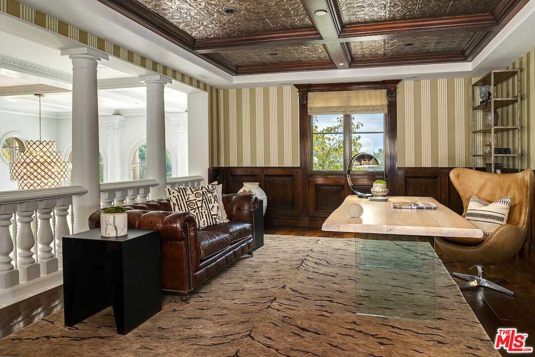 11025 Anzio Road Los Angeles, CA 90077 - Photo 20 of 34 a living room with furniture and a floor to ceiling window