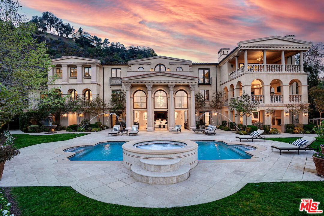 11025 Anzio Road Los Angeles, CA 90077 - Photo 3 of 34 a front view of a house with garden