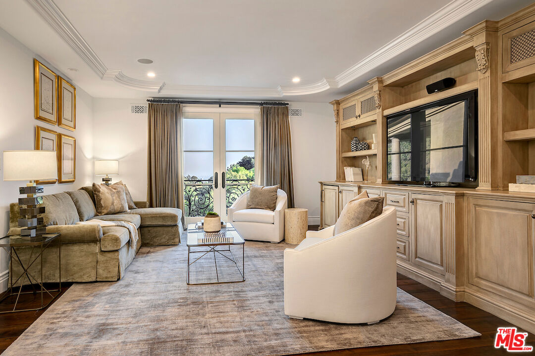11025 Anzio Road Los Angeles, CA 90077 - Photo 23 of 34 a living room with furniture and large windows