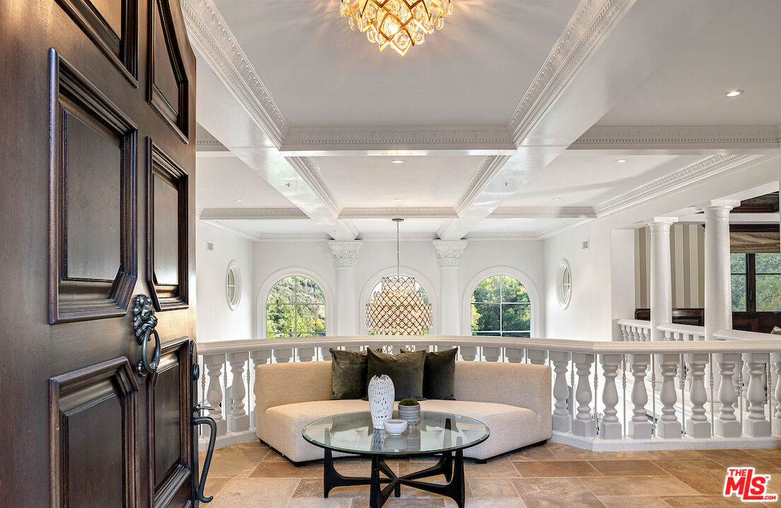 11025 Anzio Road Los Angeles, CA 90077 - Photo 7 of 34 a living room with furniture and a window