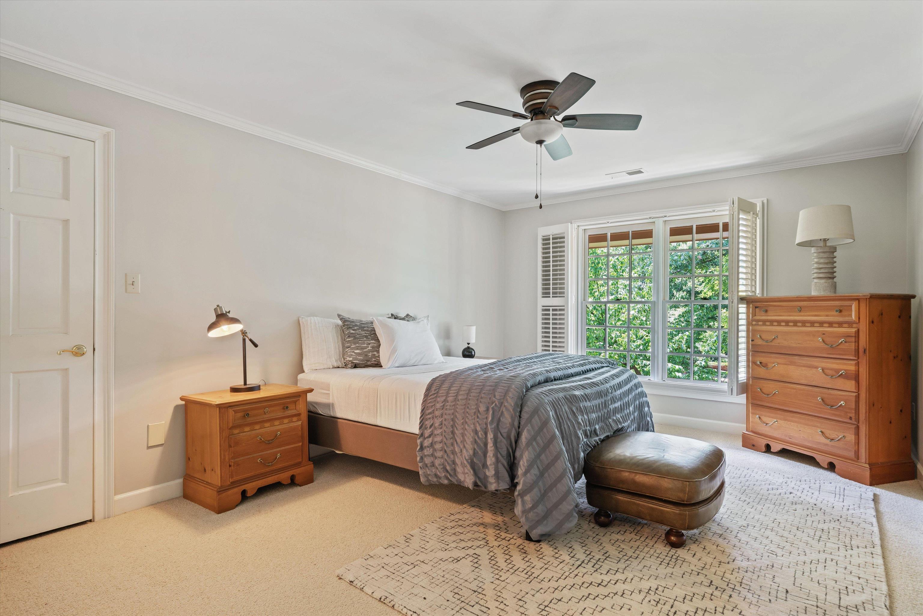 8897 Forest Ridge Cove Memphis, TN 38018 - Photo 19 of 35 Bedroom featuring light carpet, ornamental molding, and a ceiling fan