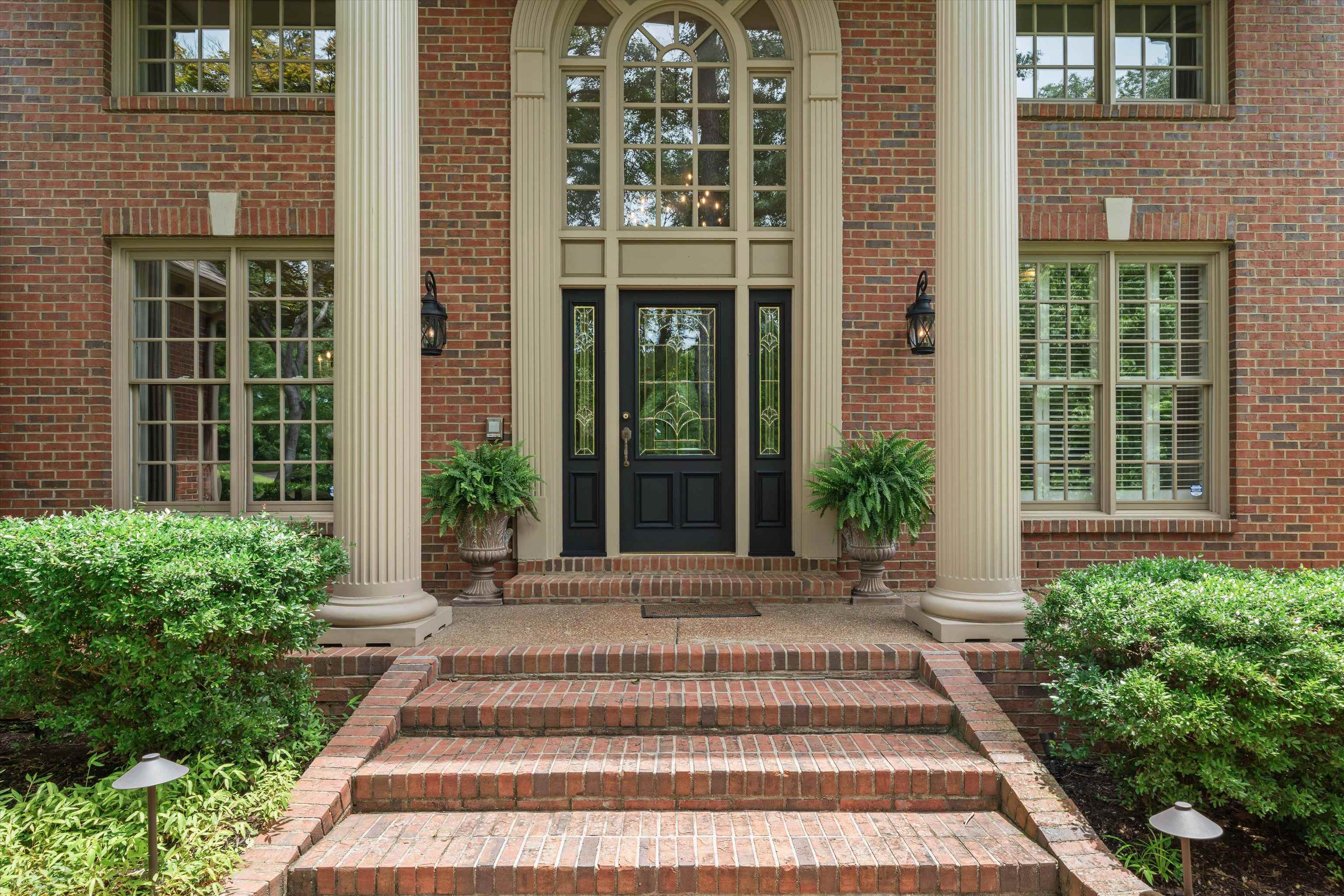 8897 Forest Ridge Cove Memphis, TN 38018 - Photo 2 of 35 Property entrance featuring brick siding