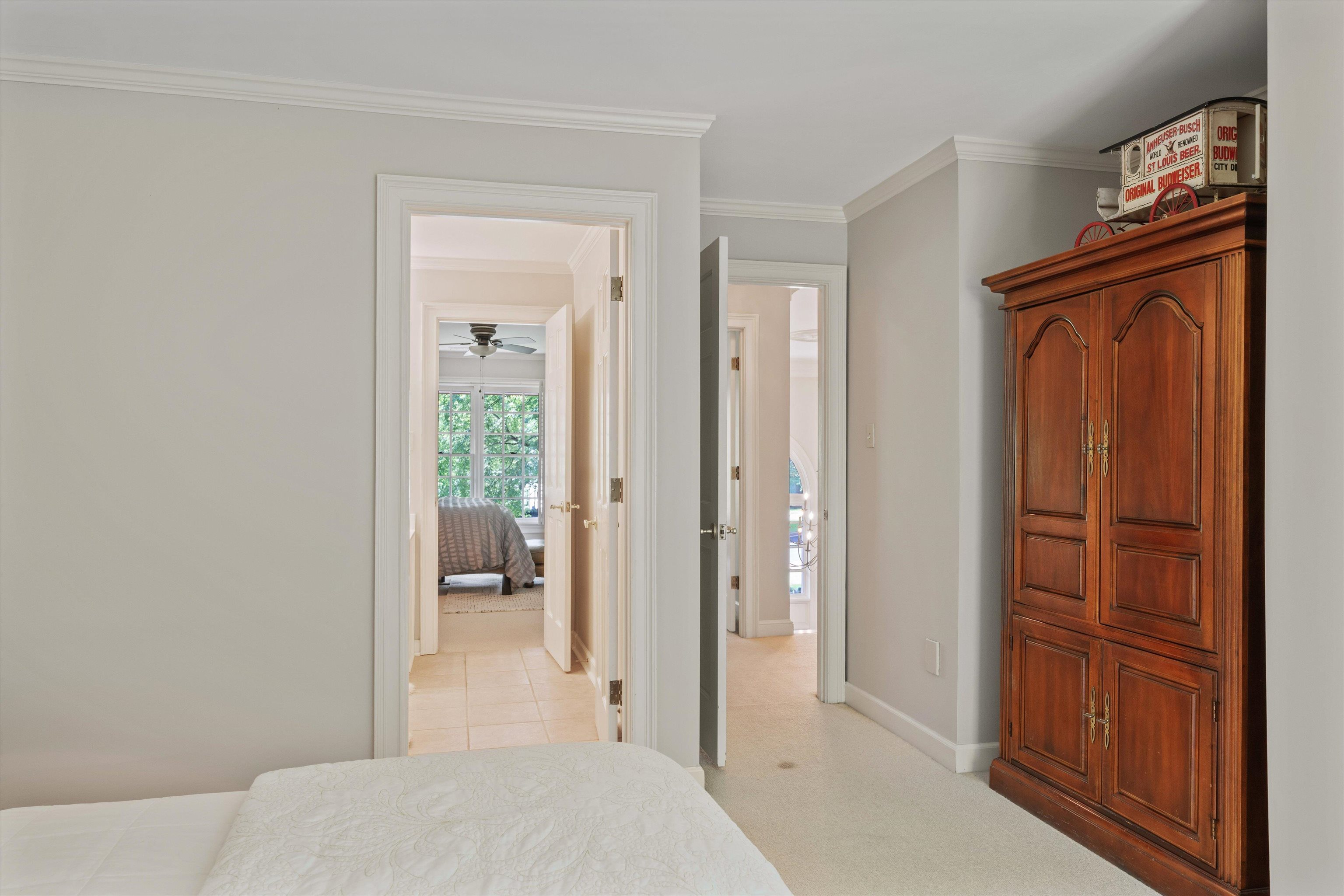8897 Forest Ridge Cove Memphis, TN 38018 - Photo 23 of 35 Bedroom featuring crown molding and baseboards