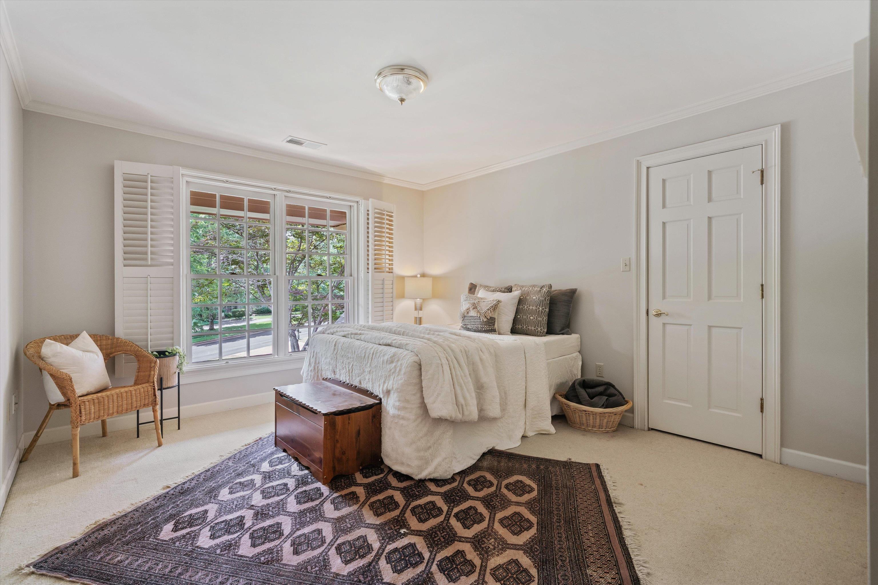 8897 Forest Ridge Cove Memphis, TN 38018 - Photo 24 of 35 Bedroom featuring carpet and ornamental molding