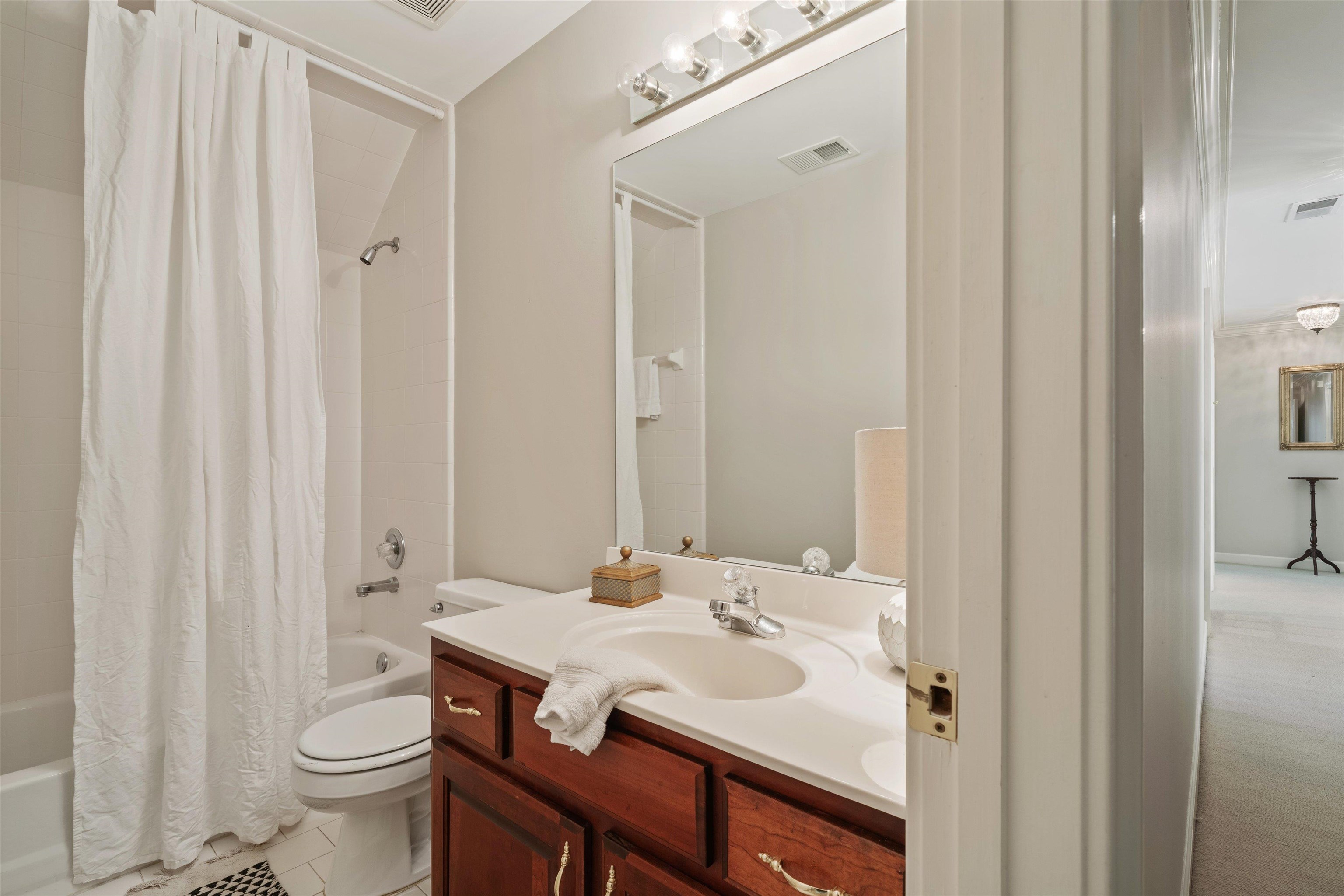 8897 Forest Ridge Cove Memphis, TN 38018 - Photo 25 of 35 Full bath featuring vanity, shower / tub combo with curtain, and tile patterned floors