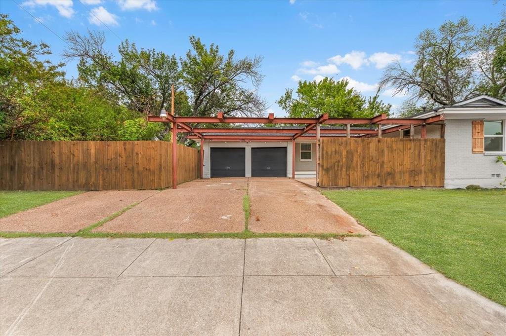 3301 Hedrick Street Fort Worth, TX 76111 - Photo 20 of 28 a porch with seating space and trees in the background