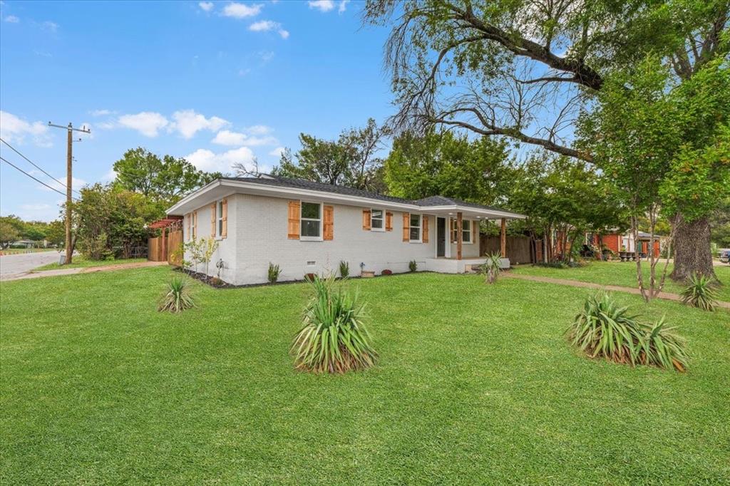 3301 Hedrick Street Fort Worth, TX 76111 - Photo 6 of 28 a view of a house with a yard