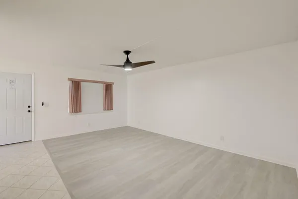 a view of empty room with windows
