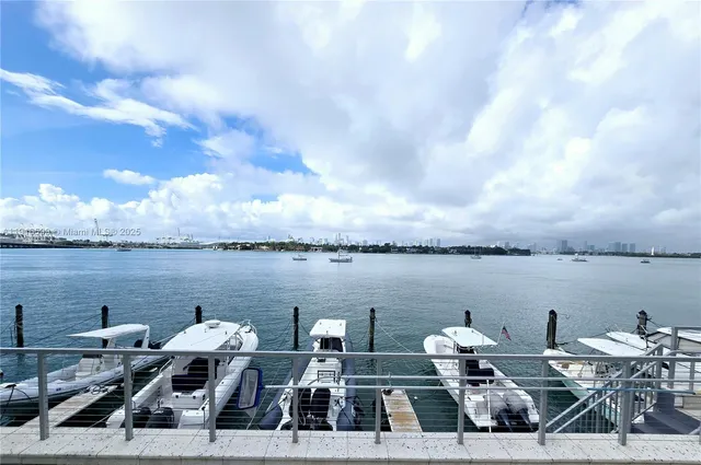 a terrace with outdoor seating and city view