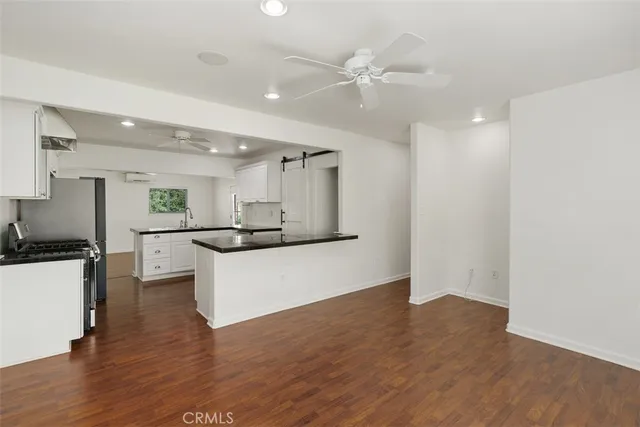 a view of kitchen with wooden floor