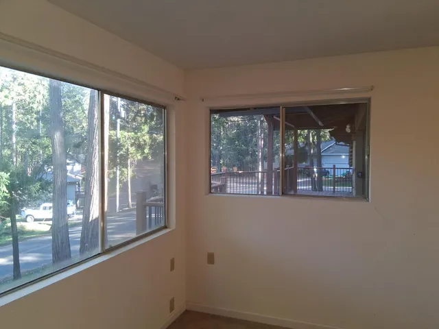 a view of a room that has a large window