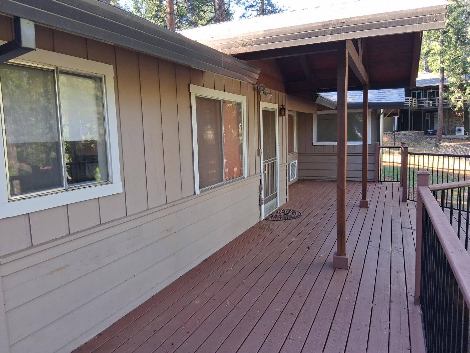 27565 Tiger Creek Road Pioneer, CA 95666 - Photo 22 of 29 a view of a house with porch and wooden floor