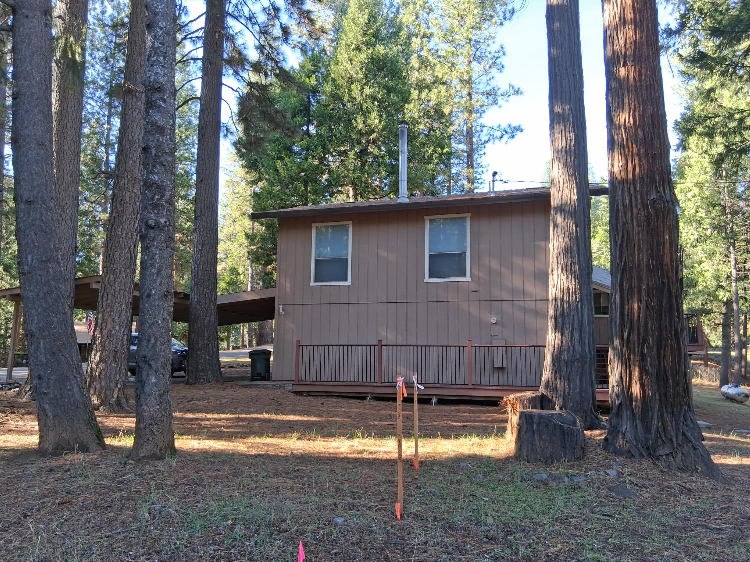 27565 Tiger Creek Road Pioneer, CA 95666 - Photo 26 of 29 a view of a house with backyard and a tree