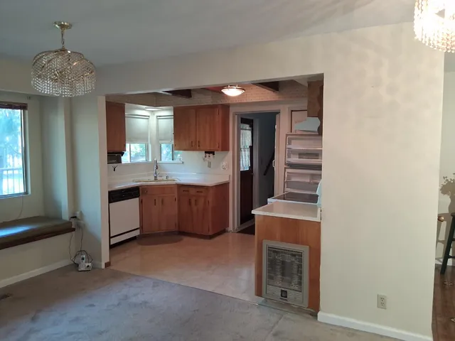 a spacious bathroom with a sink and a mirror