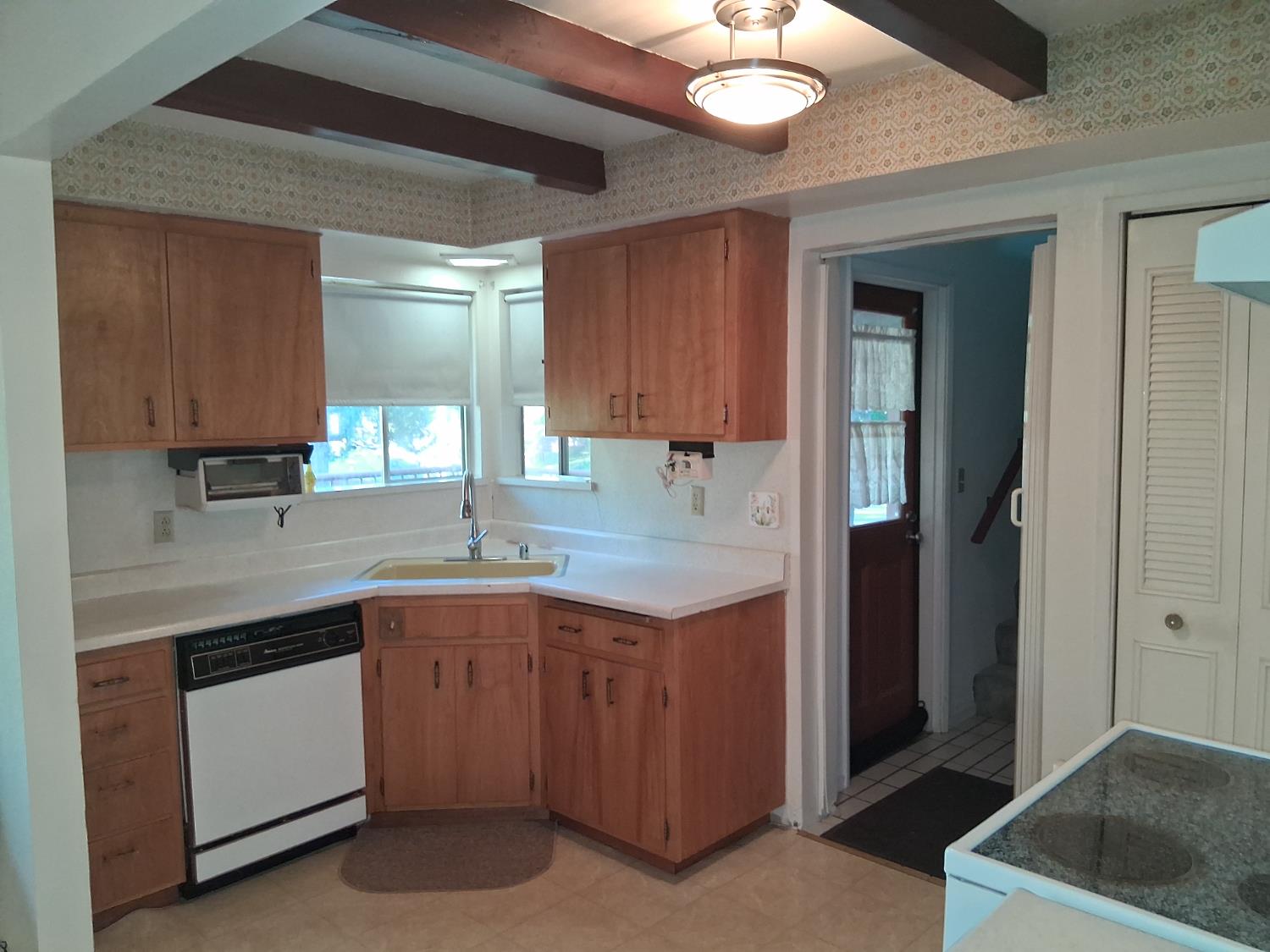27565 Tiger Creek Road Pioneer, CA 95666 - Photo 8 of 29 a kitchen with a sink and cabinets