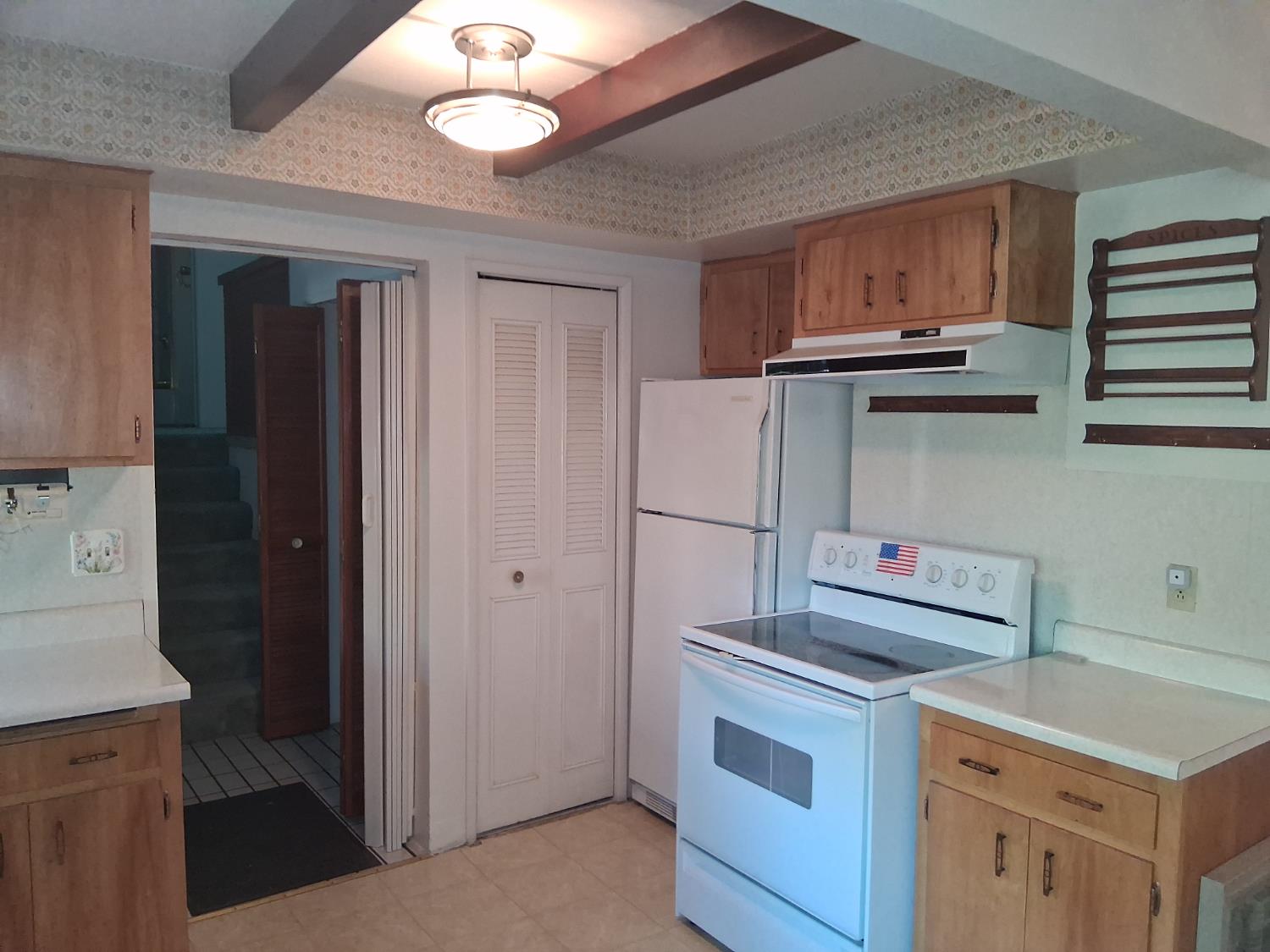 27565 Tiger Creek Road Pioneer, CA 95666 - Photo 9 of 29 a kitchen with a stove and a refrigerator