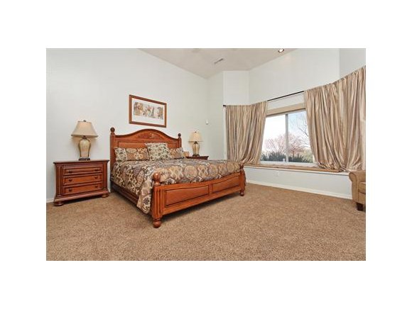 3690 Black Jack Ridge Road Prescott, AZ 86305 - Photo 11 of 23 a spacious bedroom with a bed and a window