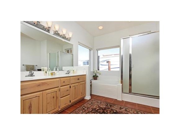 3690 Black Jack Ridge Road Prescott, AZ 86305 - Photo 12 of 23 a bathroom with a sink a mirror and a shower