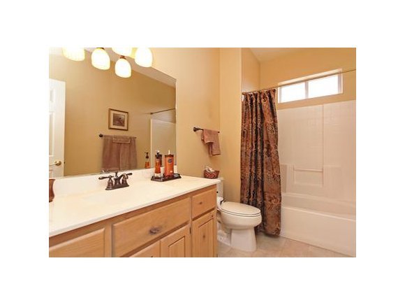 3690 Black Jack Ridge Road Prescott, AZ 86305 - Photo 15 of 23 a bathroom with a sink a toilet a mirror and shower