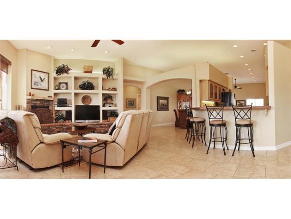 3690 Black Jack Ridge Road Prescott, AZ 86305 - Photo 6 of 23 a living room with furniture a table and kitchen view