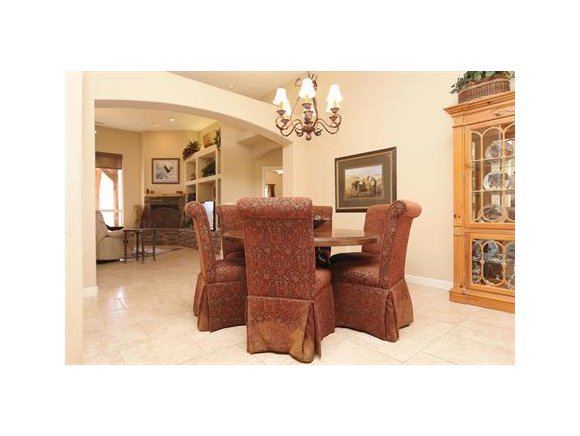 3690 Black Jack Ridge Road Prescott, AZ 86305 - Photo 8 of 23 a living room with furniture chandelier and a window