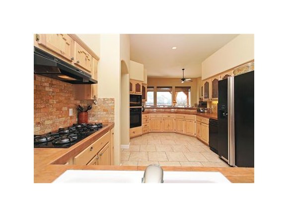 3690 Black Jack Ridge Road Prescott, AZ 86305 - Photo 10 of 23 a kitchen with stainless steel appliances granite countertop a refrigerator and a stove