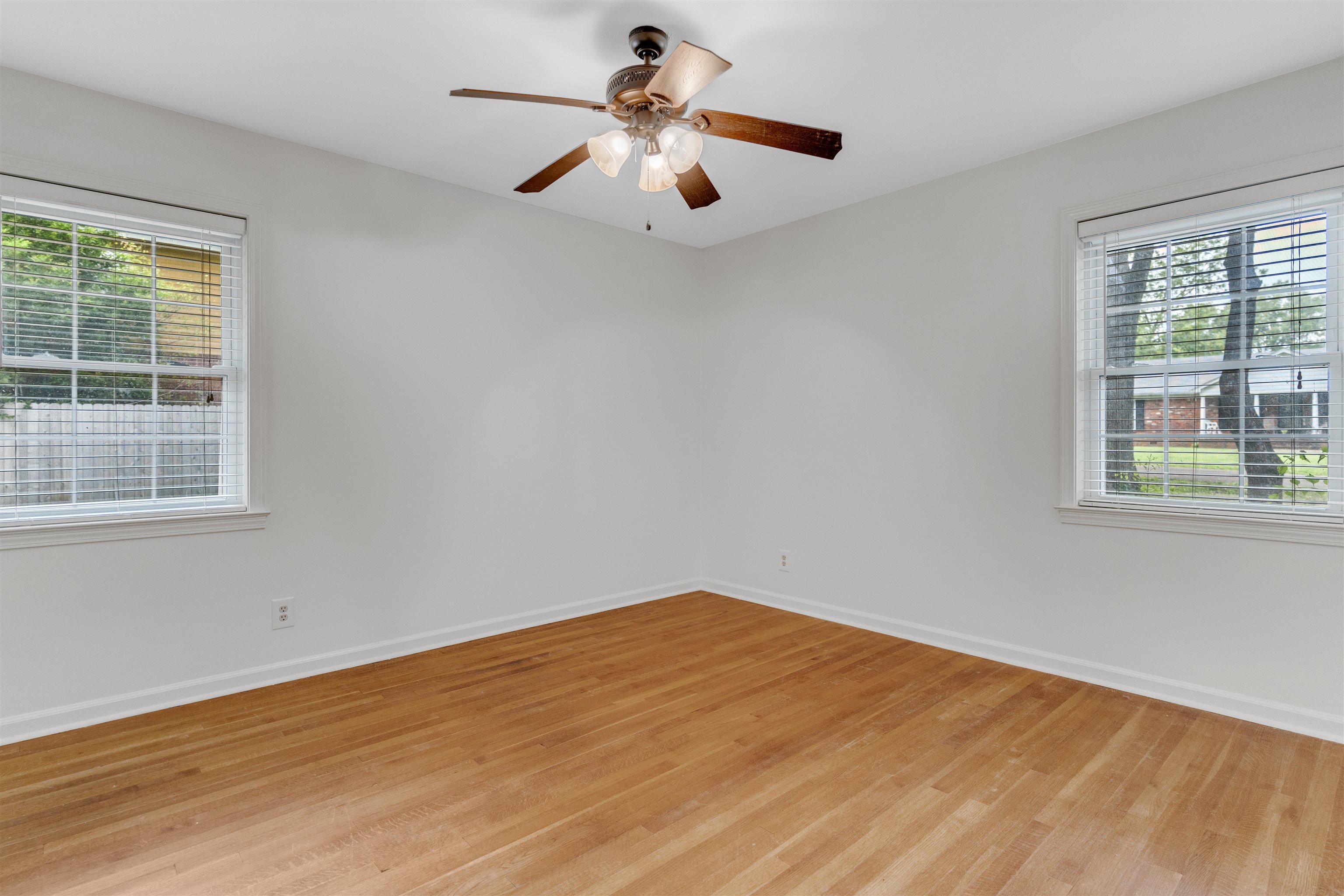 281 Ailene Road Collierville, TN 38017 - Photo 23 of 30 Empty room with light wood-style floors, plenty of natural light, and baseboards