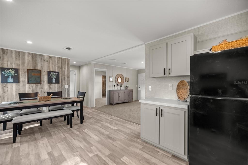 1560 Northeast 162nd Street Citra, FL 32113 - Photo 11 of 33 a living room with furniture a piano and a flat screen tv