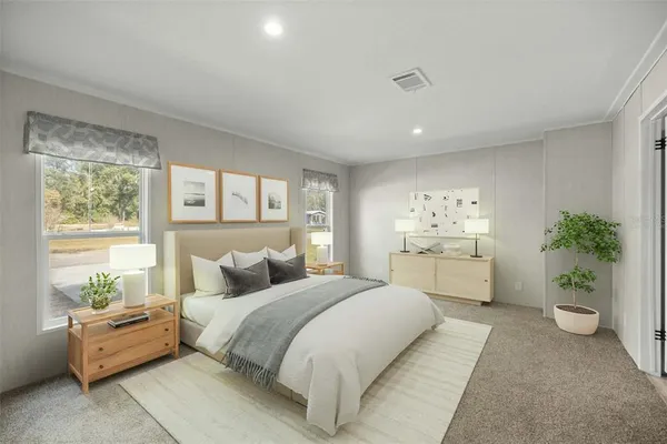 a bedroom with a large bed and a couch