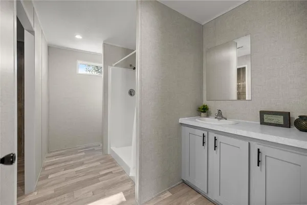 a bathroom with a sink and mirror