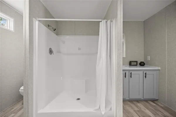 a bathroom with a bathtub and shower