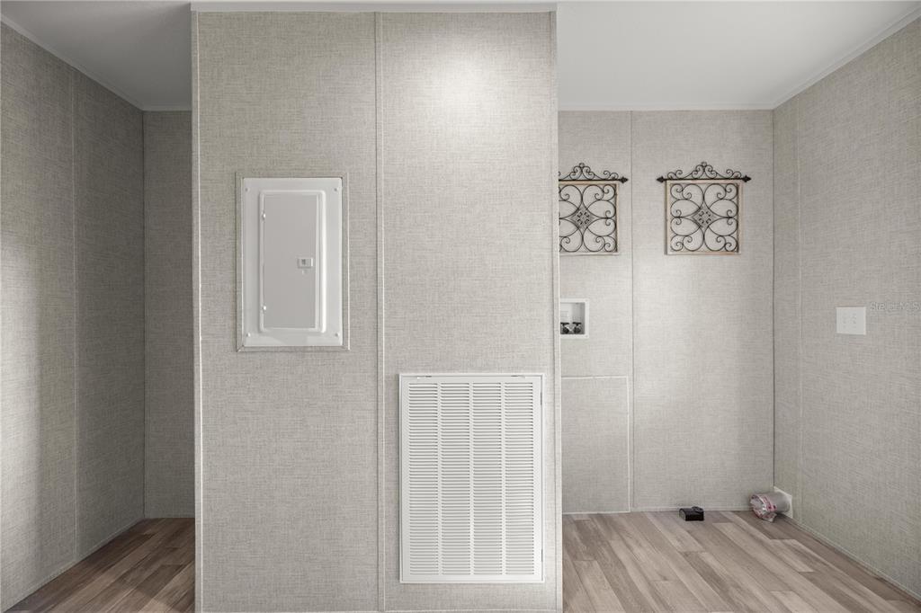 1560 Northeast 162nd Street Citra, FL 32113 - Photo 25 of 33 a view of a hallway with wooden floor and closet