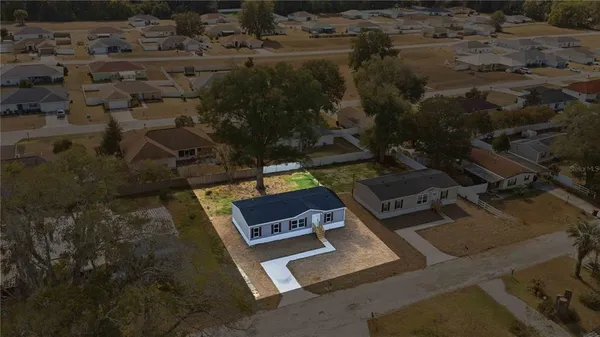 an aerial view of residential house with outdoor space