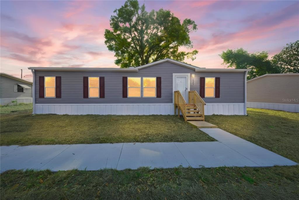 1560 Northeast 162nd Street Citra, FL 32113 - Photo 33 of 33 a front view of a house with garden