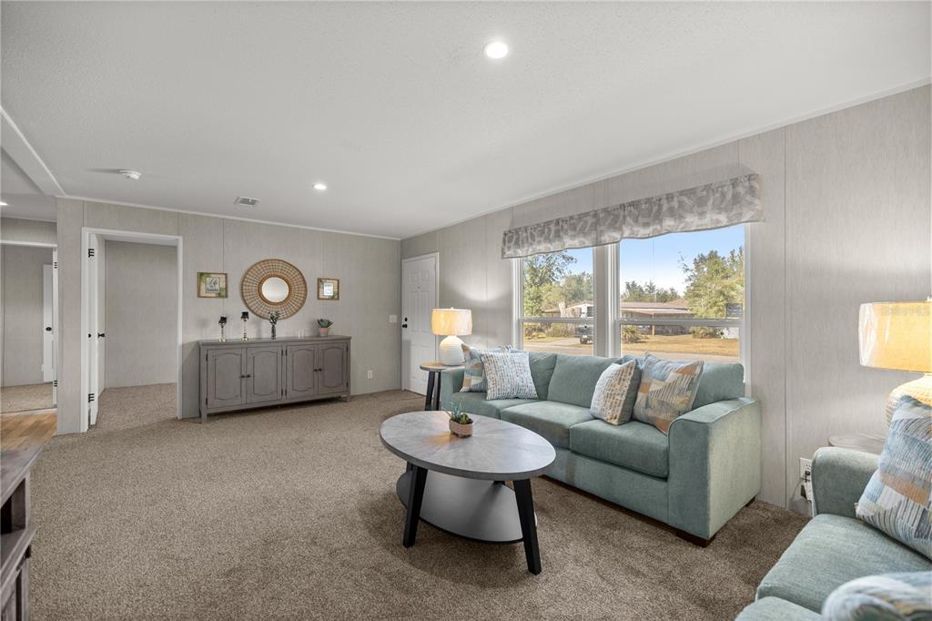 1560 Northeast 162nd Street Citra, FL 32113 - Photo 5 of 33 a living room with furniture and a large window