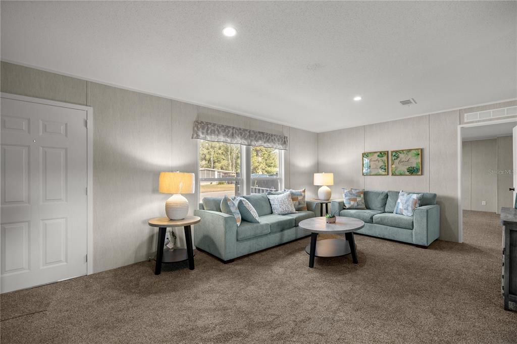 1560 Northeast 162nd Street Citra, FL 32113 - Photo 6 of 33 a living room with furniture and a window