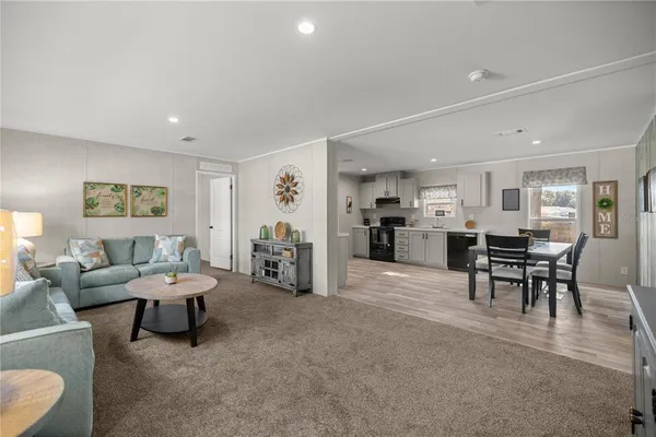 a living room with furniture and a table