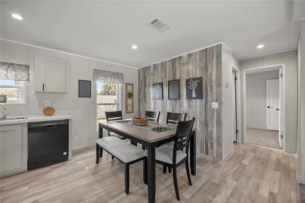 a kitchen with a table and chairs in it