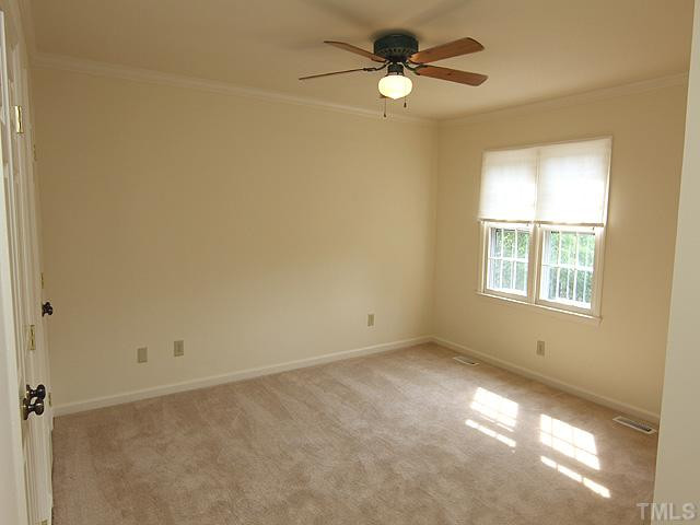 6143 Bushmills Street Raleigh, NC 27613 - Photo 8 of 11 a view of an empty room with a window