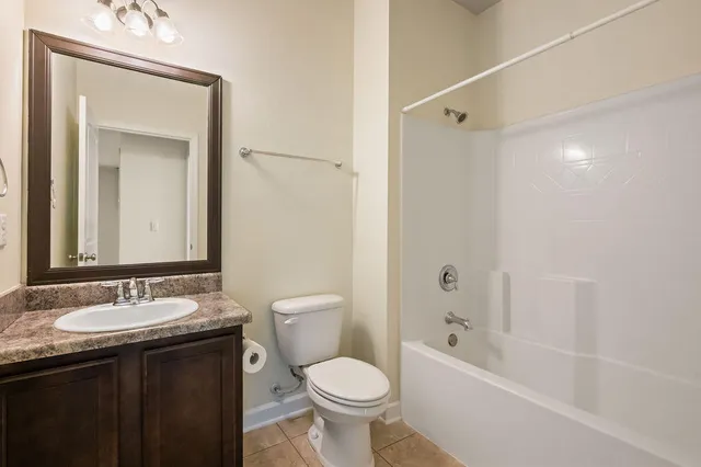 a view of a room that has a window and a bath tub