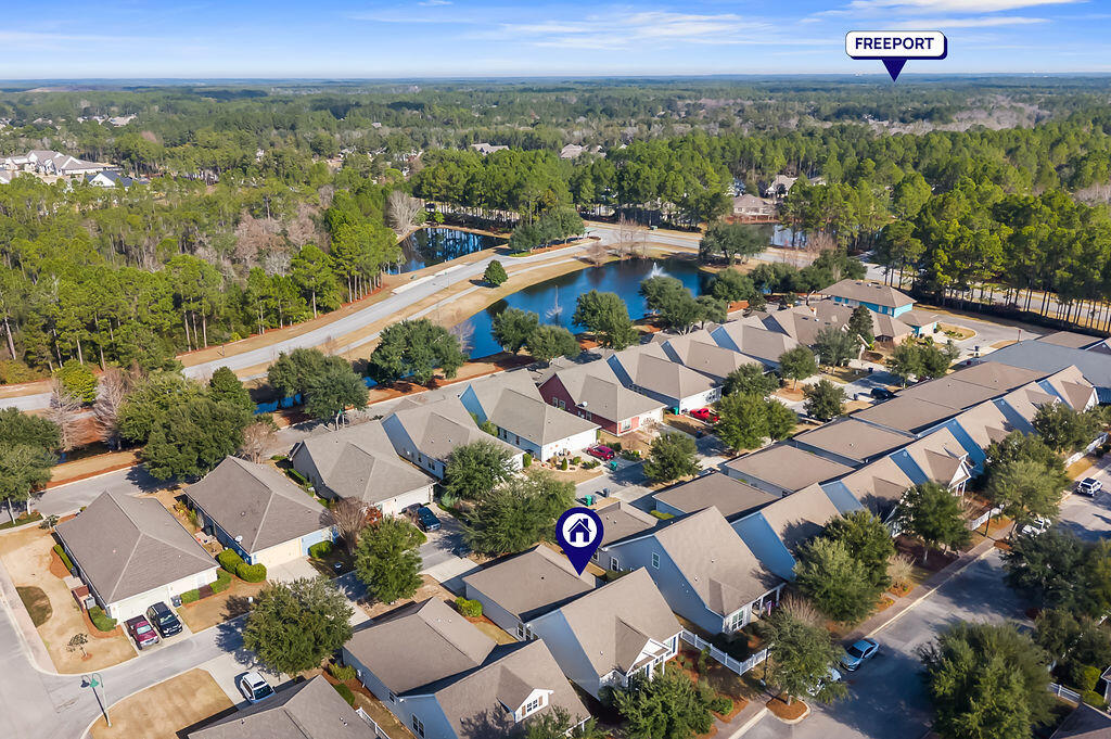 108 Nelly Street Freeport, FL 32439 - Photo 26 of 59 an aerial view of a city with lots of residential buildings and mountain view in back