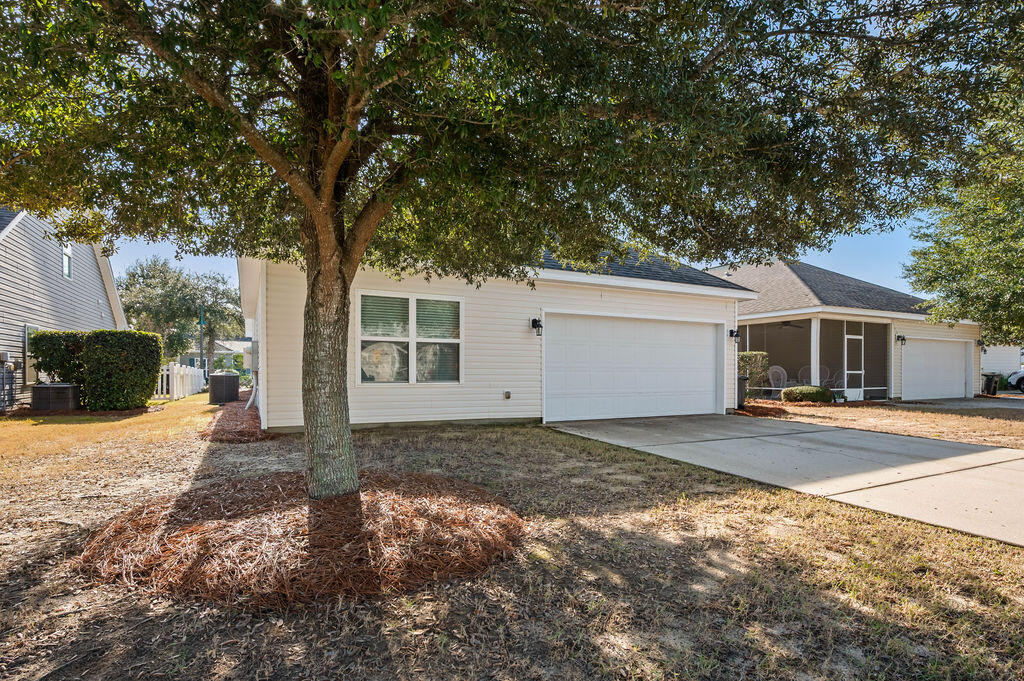108 Nelly Street Freeport, FL 32439 - Photo 4 of 59 a view of a house with a yard