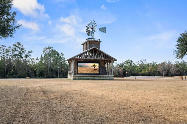 an aerial view of a house with outdoor space