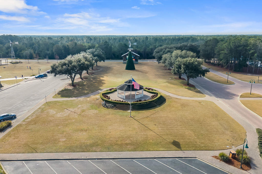 108 Nelly Street Freeport, FL 32439 - Photo 45 of 59 a backyard of a house with table and chairs