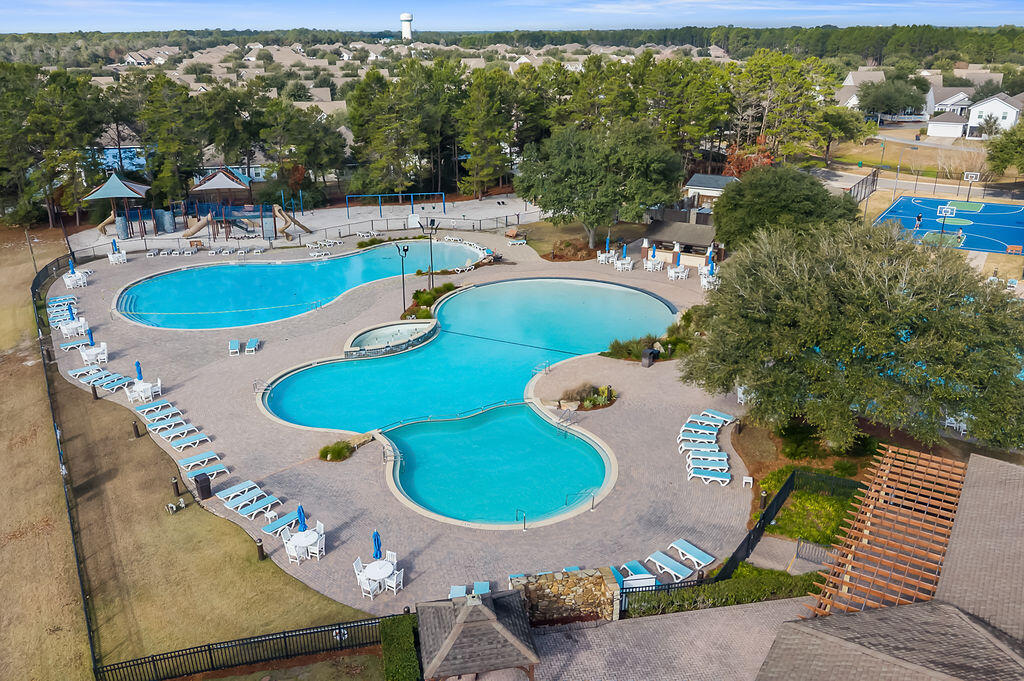 108 Nelly Street Freeport, FL 32439 - Photo 49 of 59 an aerial view of a house with swimming pool patio and outdoor seating